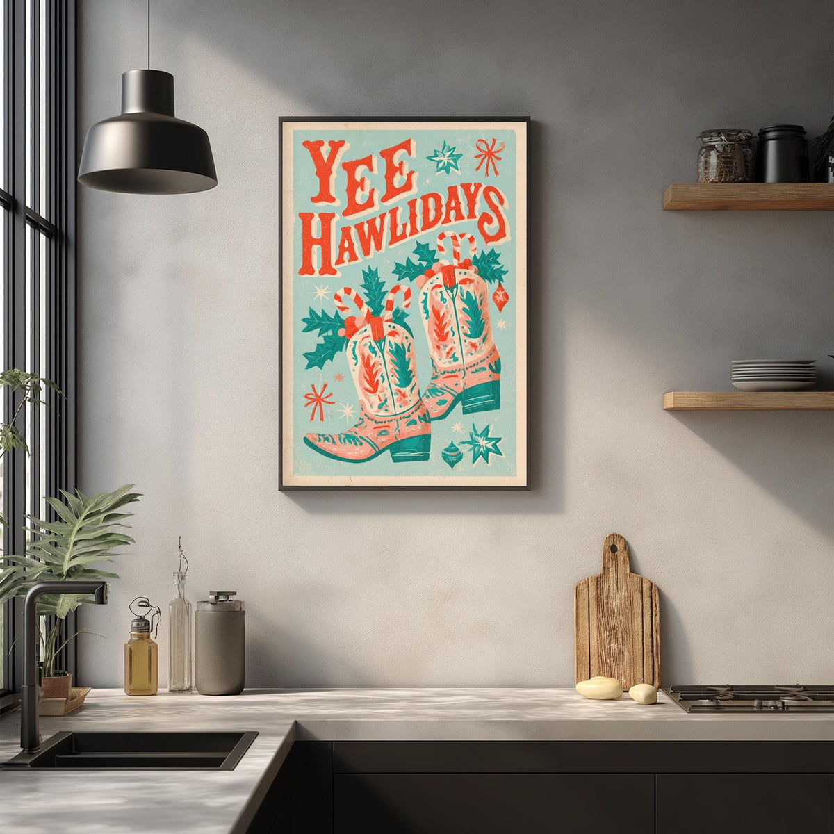 a kitchen counter with various kitchen items, such as a cutting board, a bottle, and a jar. Above the counter, there is a framed poster with a colorful design and text that reads "YEEhawlidades".