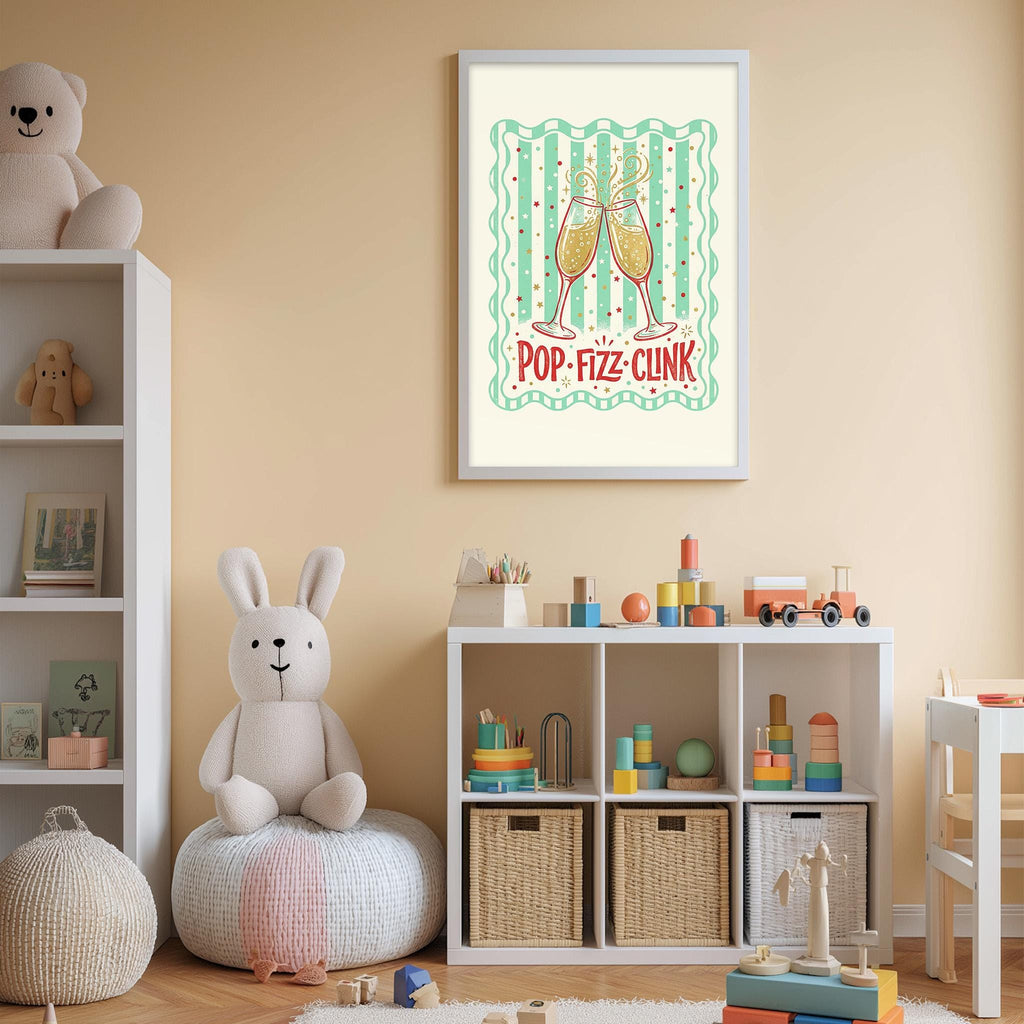 A child's bedroom with a white bookshelf, a stuffed rabbit, and a toy train. The wall has a framed poster with a cartoon image of two champagne glasses and the text "POP-FIZZ-CLINK".