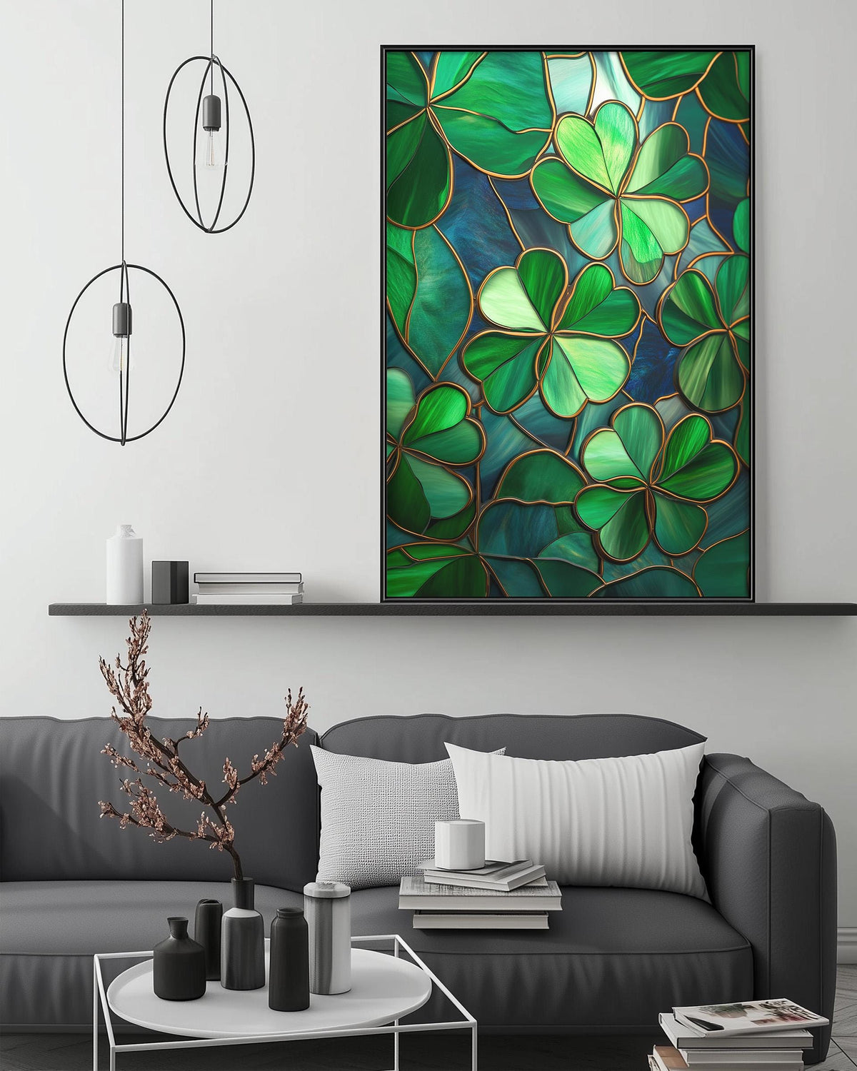 a modern living room with a gray sofa, a coffee table, and a large framed artwork of green shamrocks hanging on the wall above the sofa.