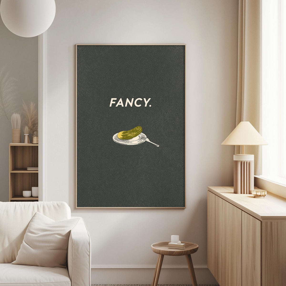 a living room with a large black framed poster on the wall that says "FANCY."