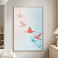 a living room with a white sofa, a wooden side table, and a framed artwork of red and blue origami birds on the wall.