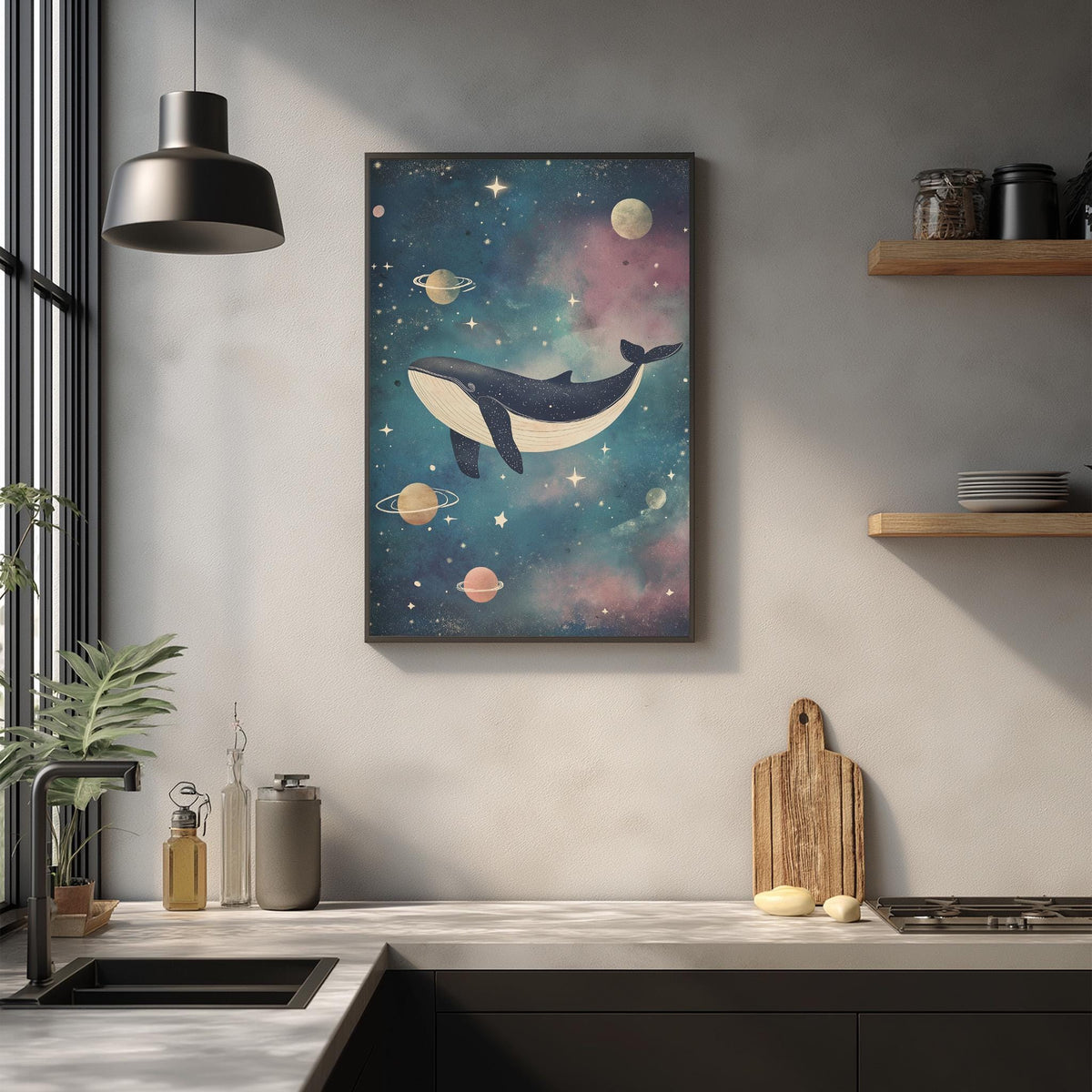 a kitchen counter with various items, including a wooden cutting board, a plant, and a framed picture of a whale floating in a starry space.