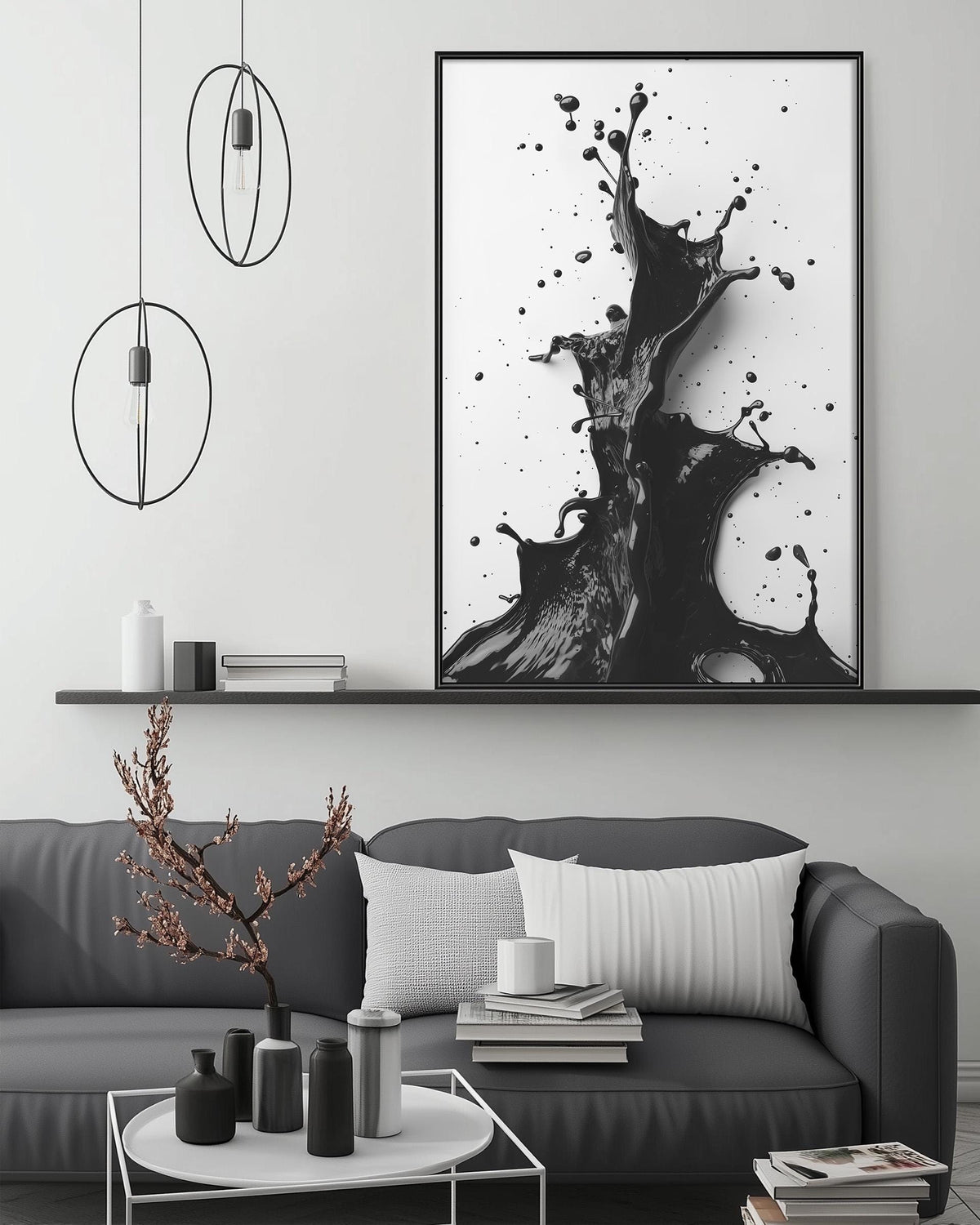 a modern living room with a gray sofa, a coffee table, and a large black and white abstract painting hanging on the wall above the sofa.