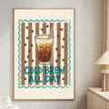 a poster with a coffee cup and the text "COLD BREW ALL DAY" on a wall in a living room.