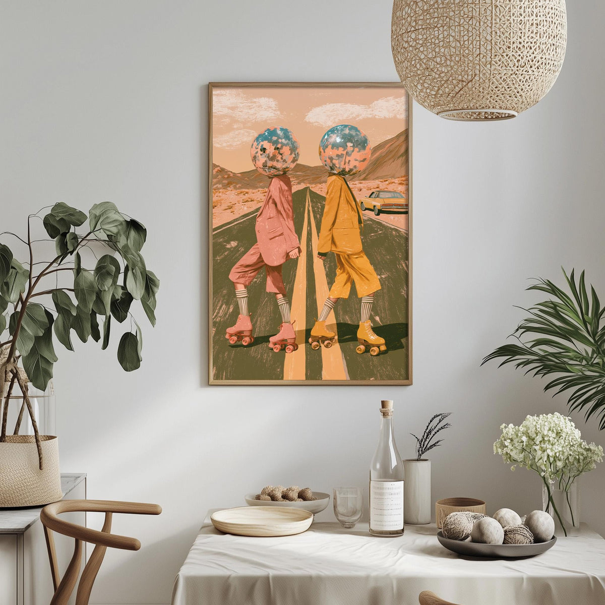 a framed artwork of two people on rollerblades, with one person wearing a pink outfit and the other wearing a yellow outfit, set against a colorful background. The artwork is displayed on a wall above a dining table, which has various decorative items such as potted plants, vases, and a bowl.