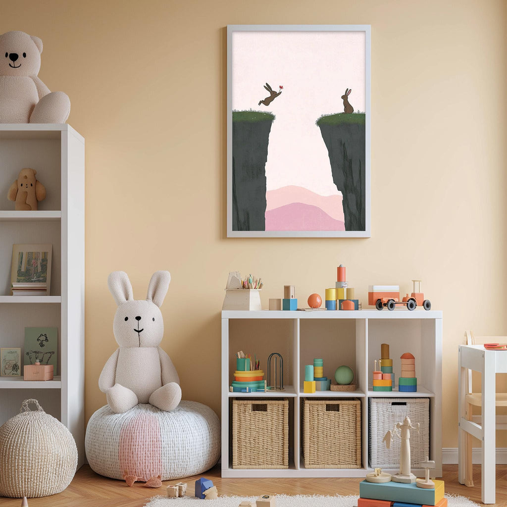 A child's bedroom with a white bookshelf, a stuffed rabbit, a toy train, and a framed picture of rabbits on a cliff.