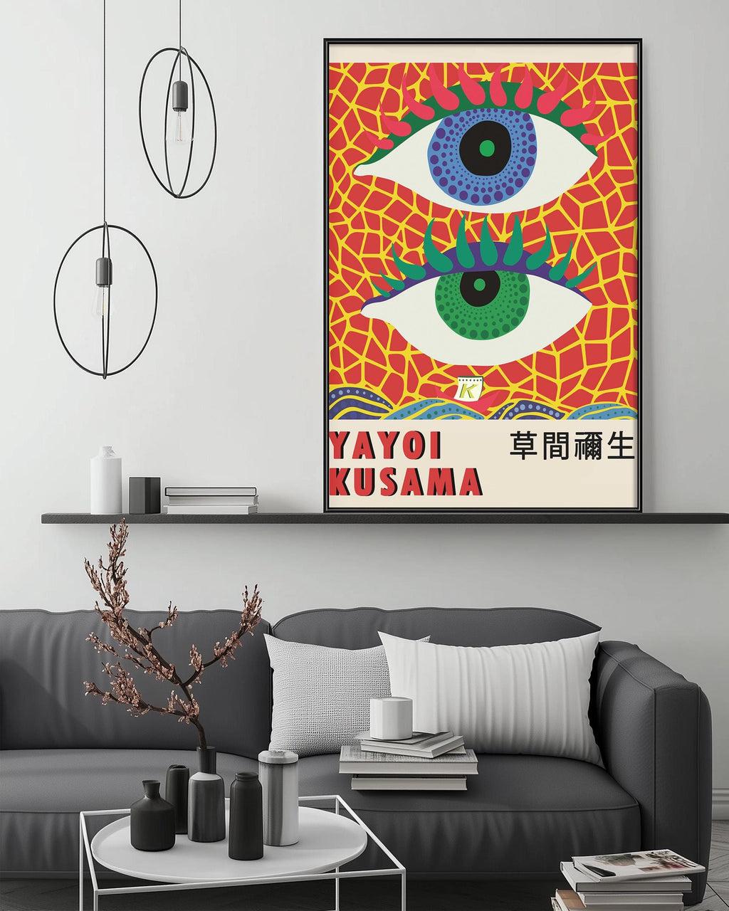 a modern living room with a gray sofa, a coffee table, and a large framed poster of a colorful abstract design hanging on the wall.