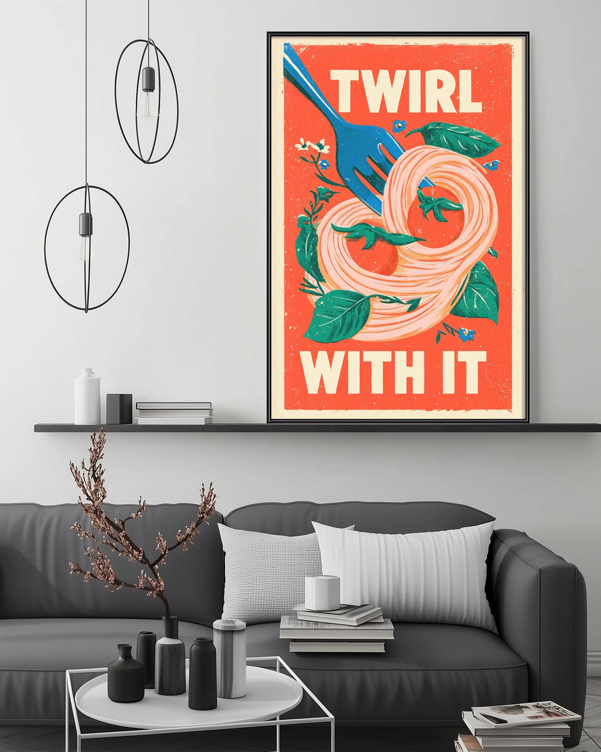 a modern living room with a gray sofa, a coffee table, and a framed poster on the wall. The poster has a vibrant design with a blue fork and a spiral pattern, and the text "TWIRL WITH IT" is prominently displayed.