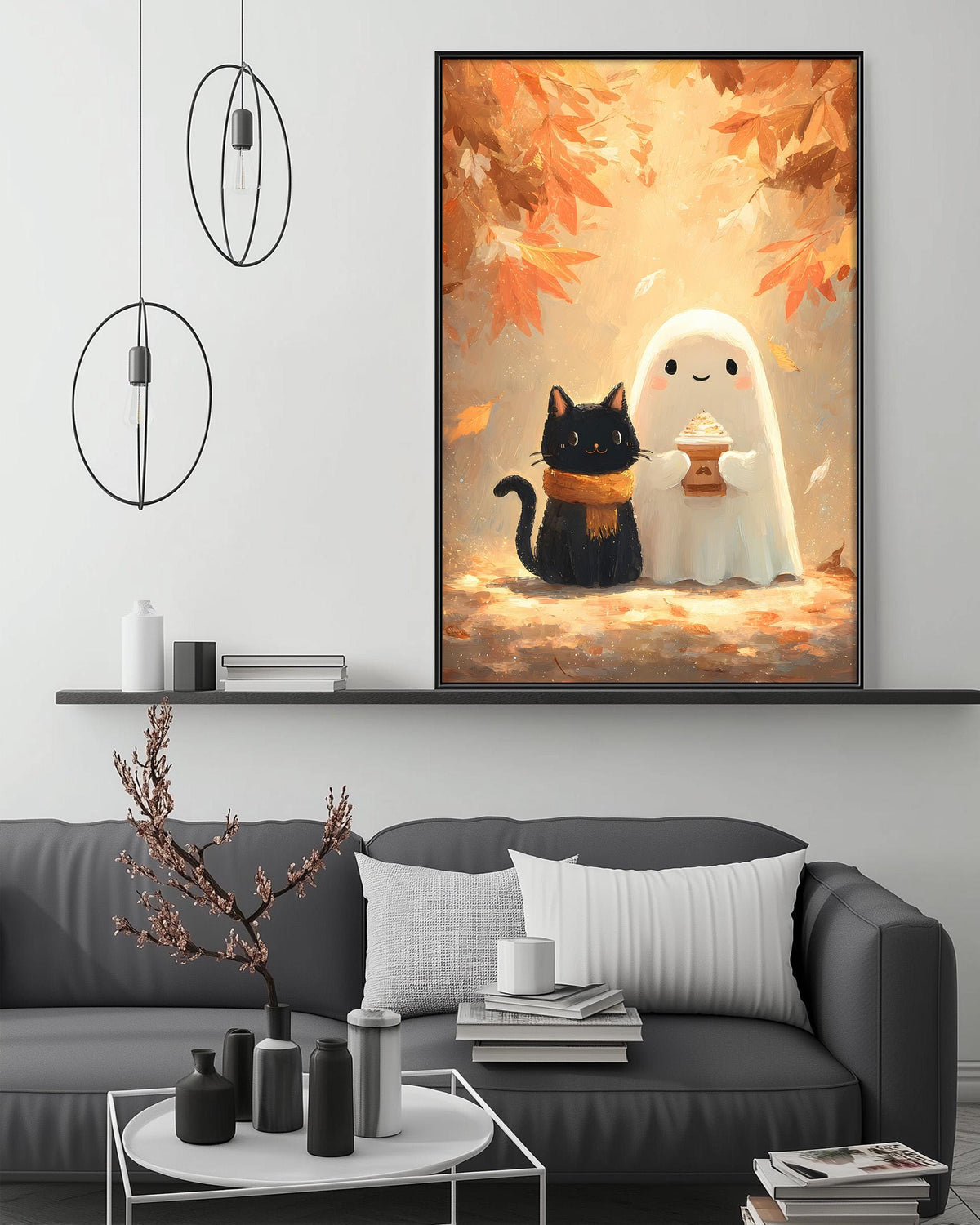 a cozy living room with a gray couch, a coffee table, and a large framed artwork depicting a black cat and a ghost in a fall scene.