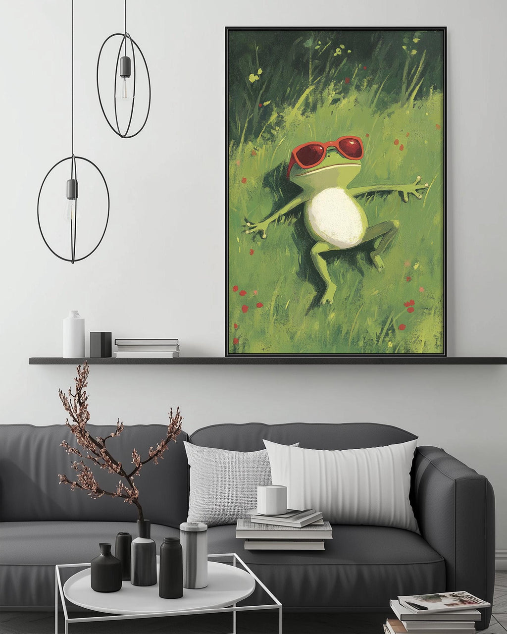 a cozy living room with a gray sofa, a coffee table, and a large framed painting of a frog wearing sunglasses, which is hanging on the wall above the sofa.