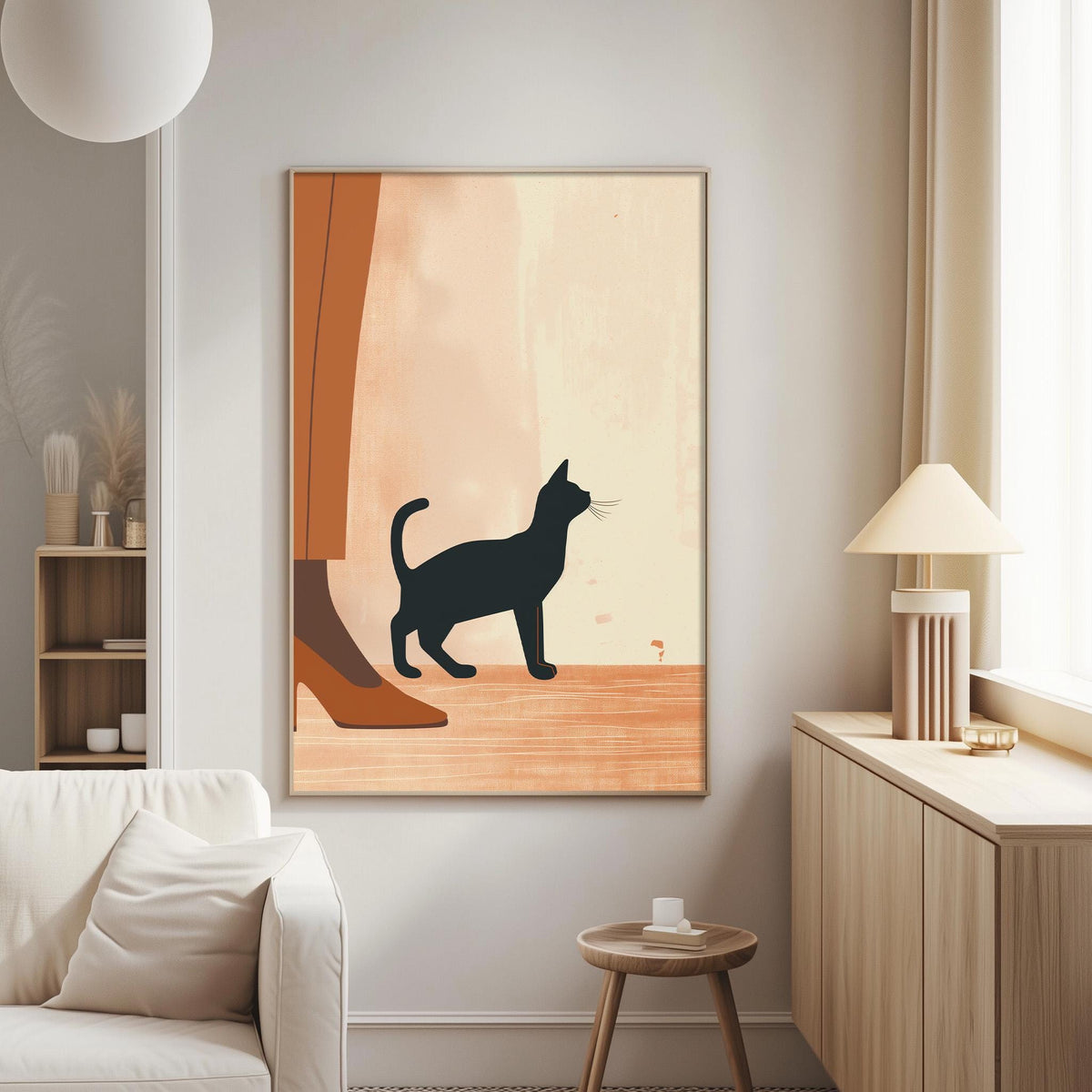 a living room with a white sofa, a wooden side table, and a framed artwork of a black cat on the wall.
