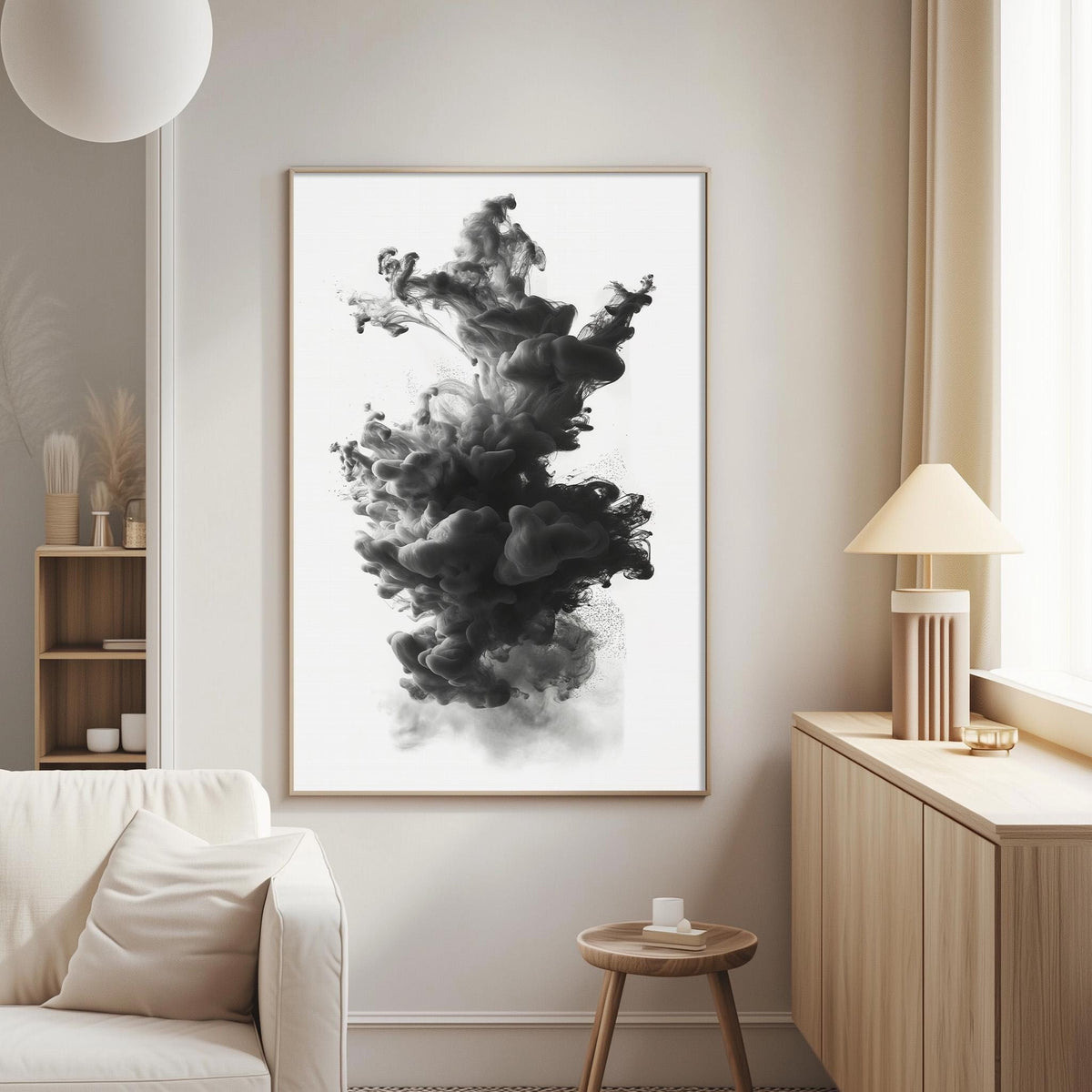 a large black and white abstract painting hanging on a wall in a living room.