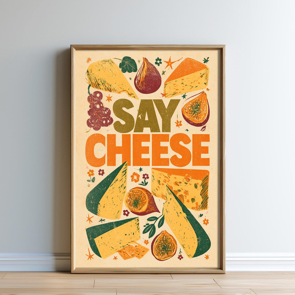 The image is a framed poster with a vibrant design featuring various cheese slices, fruits, and vegetables. The text "SAY CHEESE" is prominently displayed in the center of the poster.