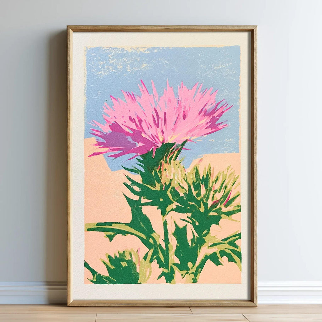 A framed print depicting a vibrant pink flower with green leaves against a blue sky background.