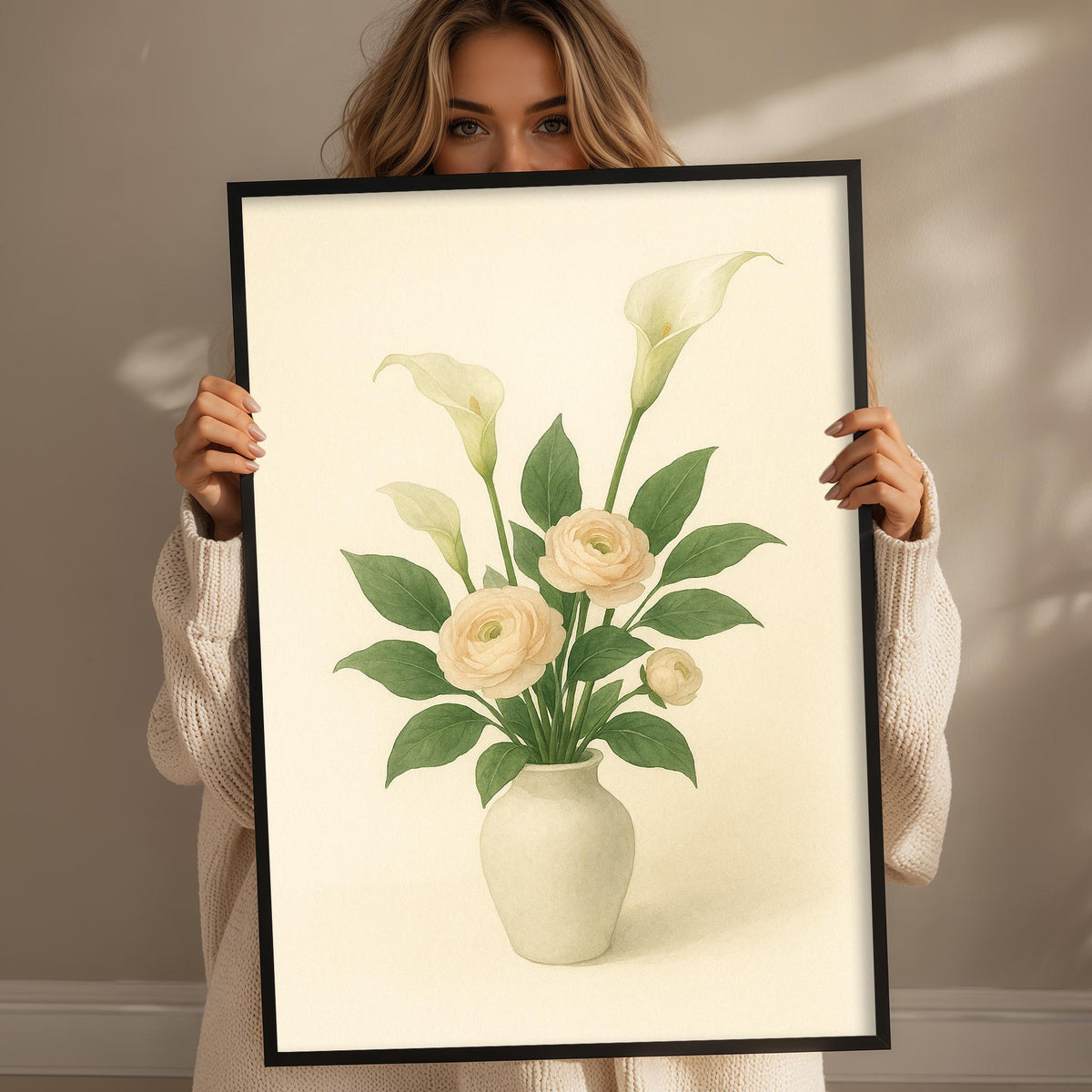 A woman holding a framed print of a vase with flowers.