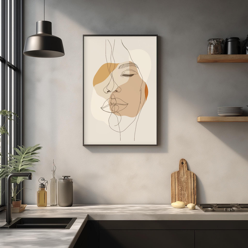 a minimalist kitchen scene with a framed abstract portrait of a woman's face hanging on the wall above a countertop with various kitchen items such as a cutting board, a soap dispenser, and a plant.