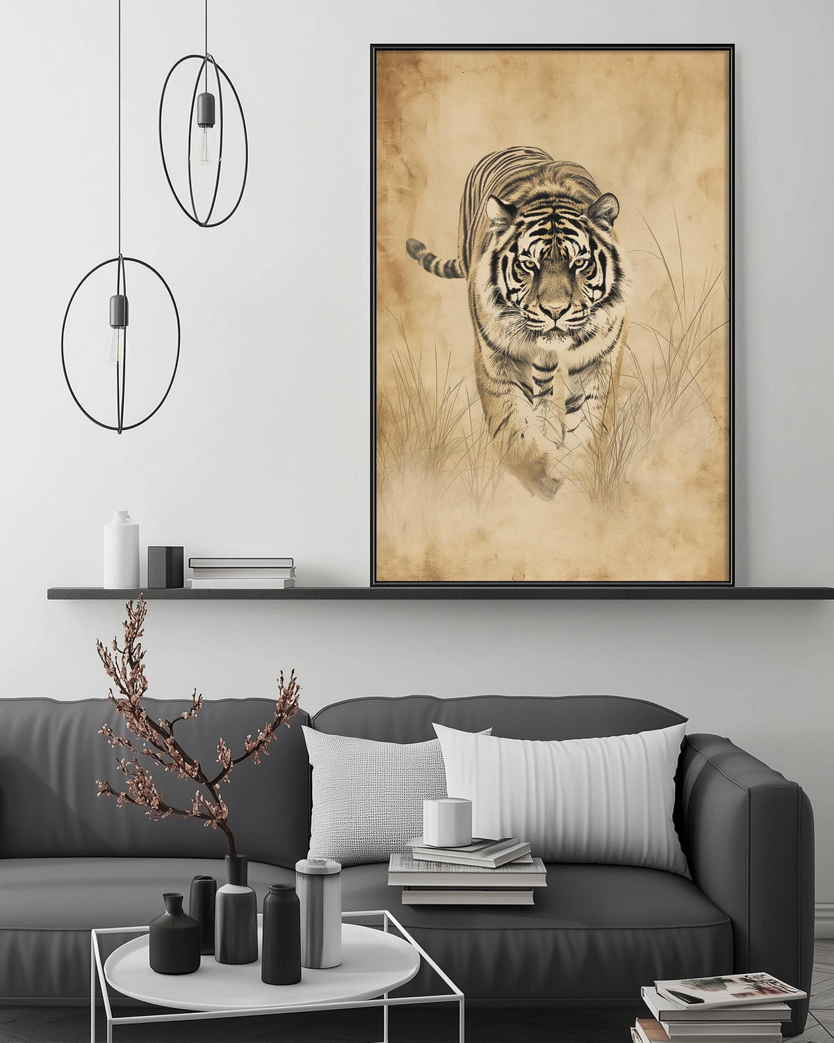 a large framed picture of a tiger on the wall above a gray couch in a living room setting.