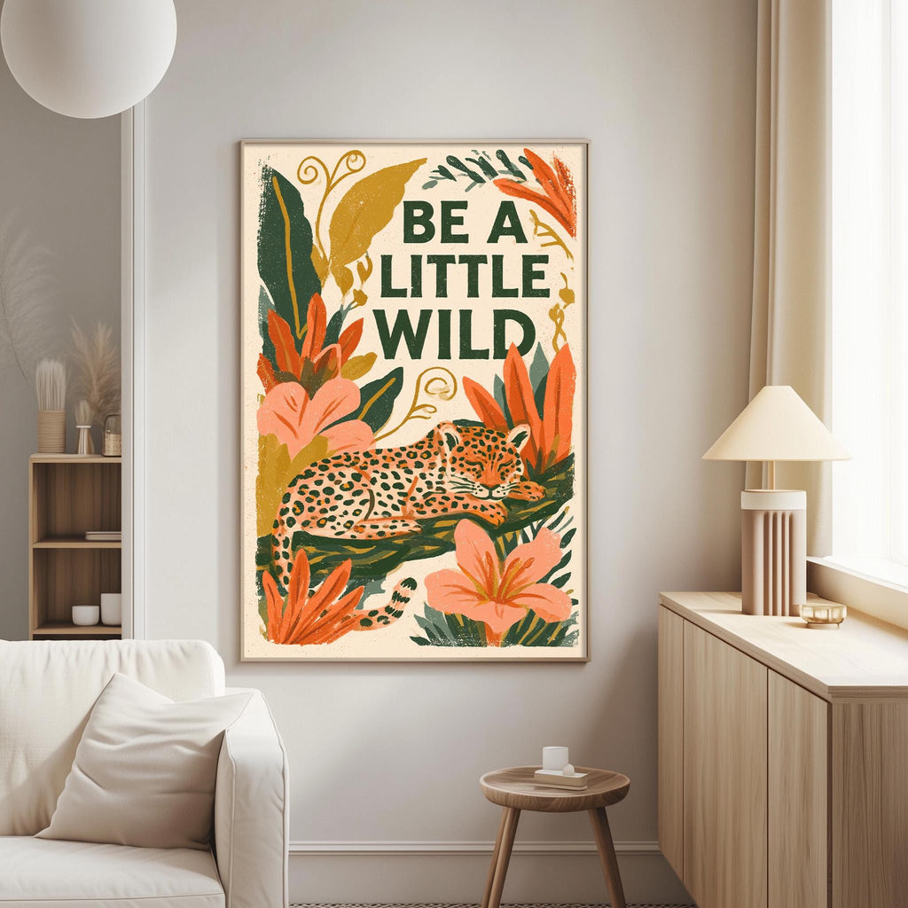 a poster with a leopard and tropical plants hanging on a wall in a living room.