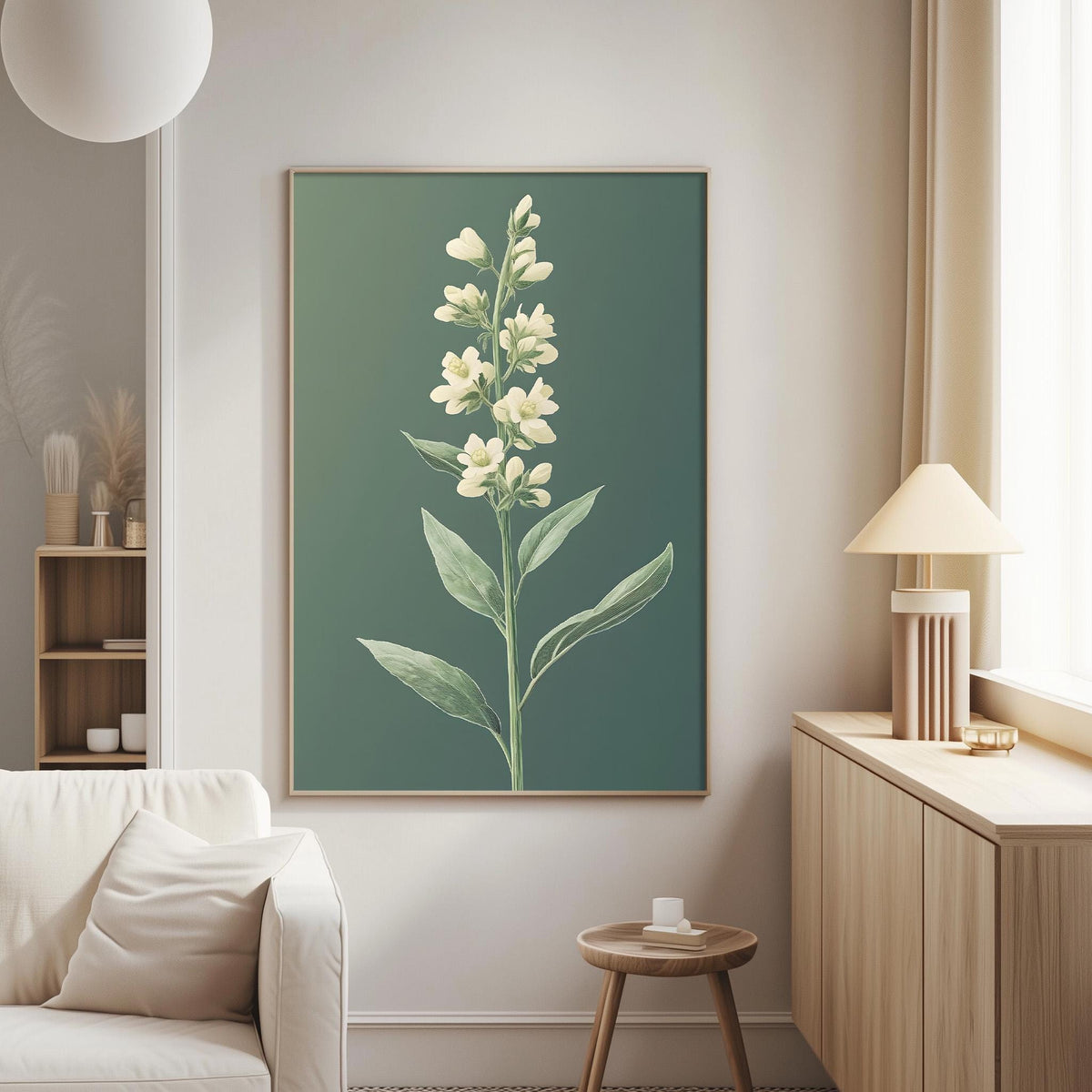 a living room with a large framed print of a white flower on the wall, a white sofa, a wooden side table, and a lamp.
