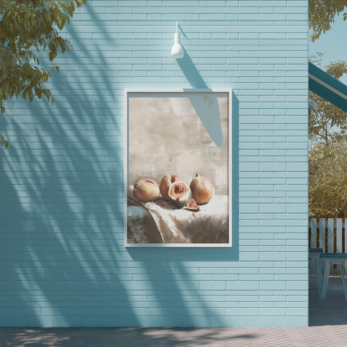 a blue brick wall with a framed painting of fruit hanging on it.