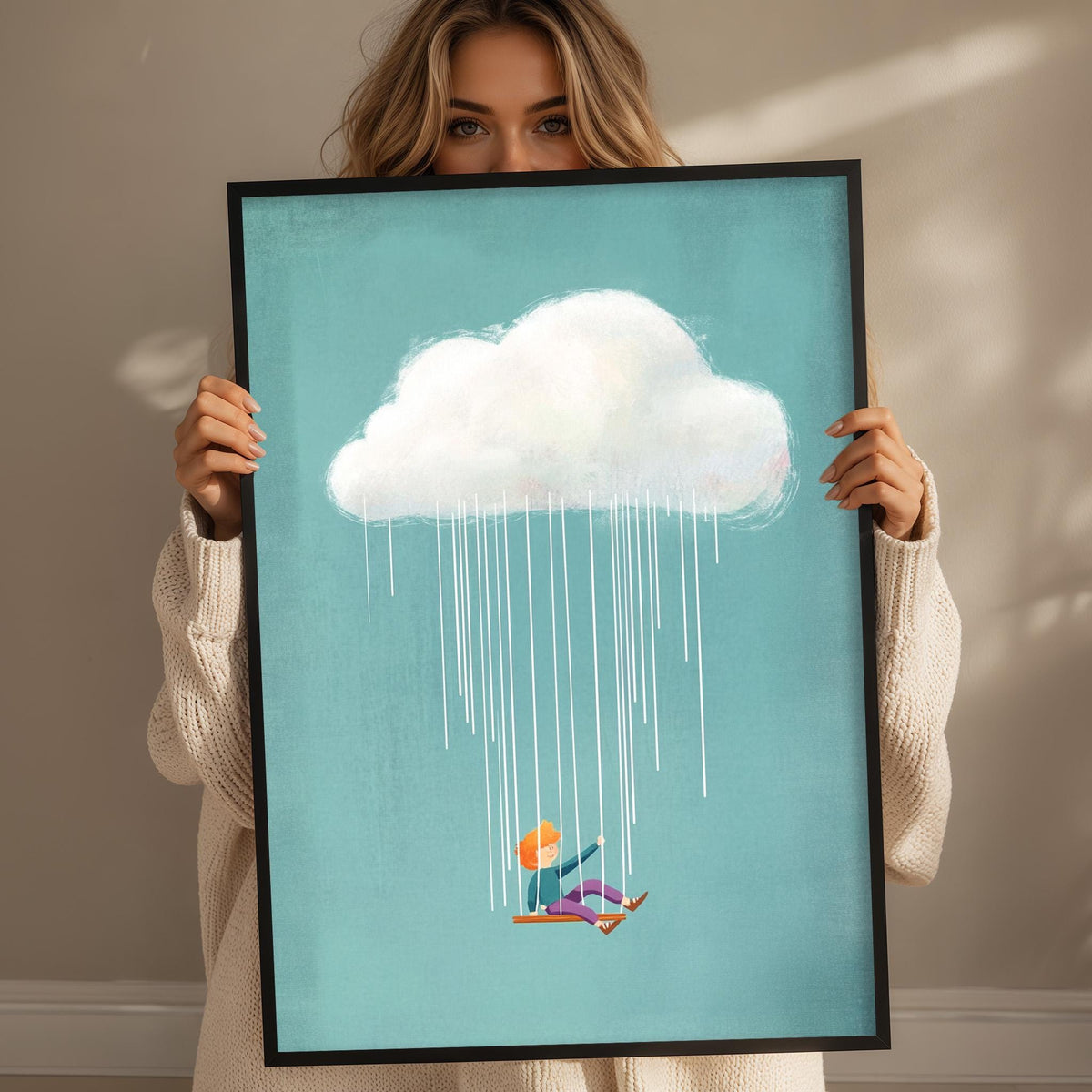 A woman holds up a framed print depicting a person riding a skateboard on a rainy day, with a large cloud of rain falling from the sky.