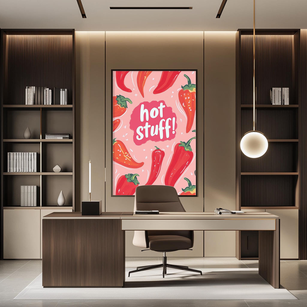 a modern office space with a large framed poster of red peppers on the wall, a wooden desk with a chair, and a bookshelf filled with books.