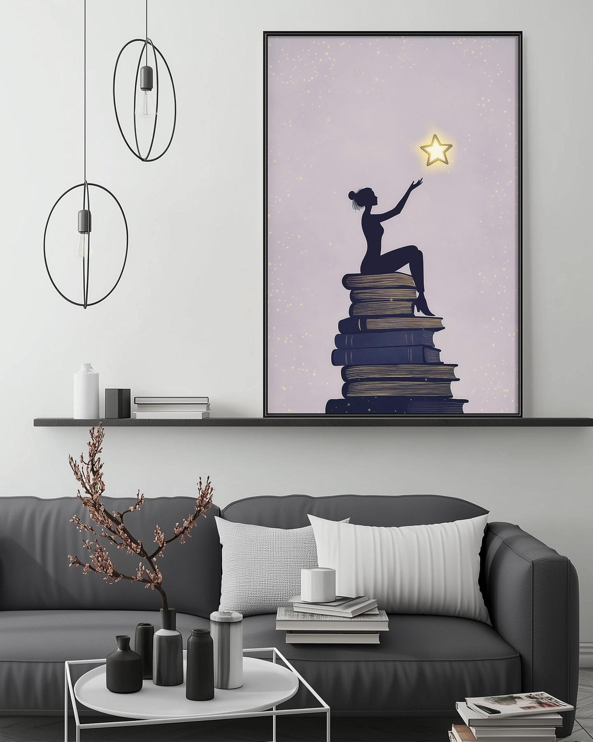 a cozy living room with a gray sofa, a coffee table, and a large framed poster of a woman sitting on a stack of books with a star above her.