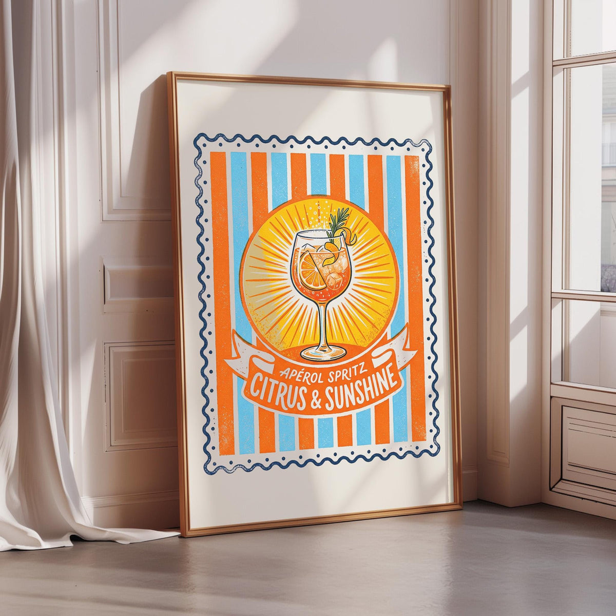 a framed poster with a vibrant illustration of a cocktail glass surrounded by citrus fruits, including oranges and lemons, against a background of orange and blue stripes.