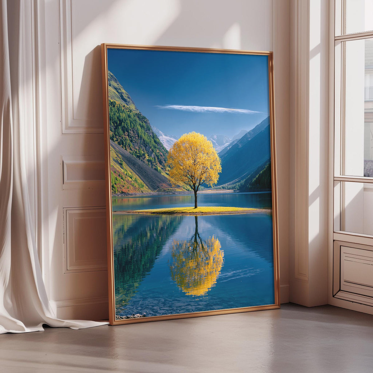 A large framed picture depicting a serene landscape with a tree in the foreground, its reflection mirrored in the calm water below, surrounded by mountains and a clear blue sky.