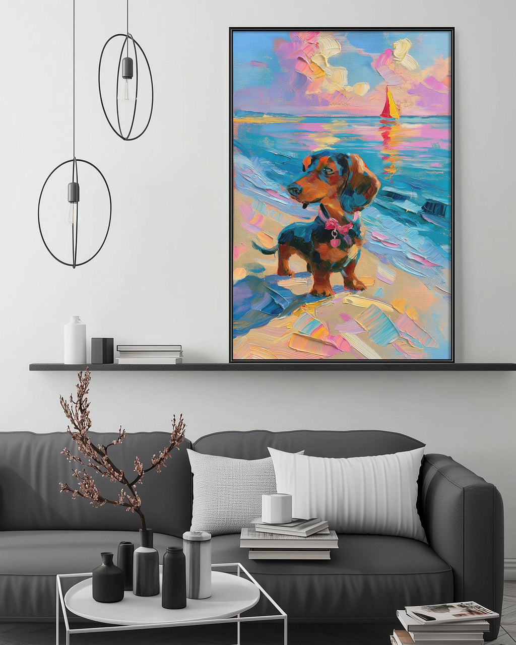 a large, colorful painting of a dog on a beach, hanging on a wall above a gray couch in a living room setting.