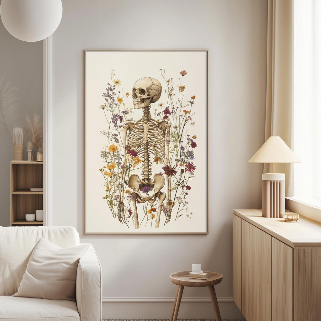 a living room with a large framed print of a skeleton surrounded by flowers on the wall.