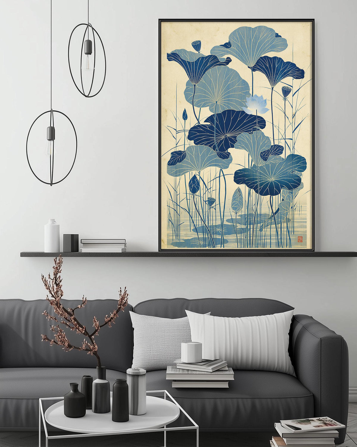 a living room with a gray sofa, a coffee table, and a large framed artwork depicting blue lotus flowers on the wall above the sofa.