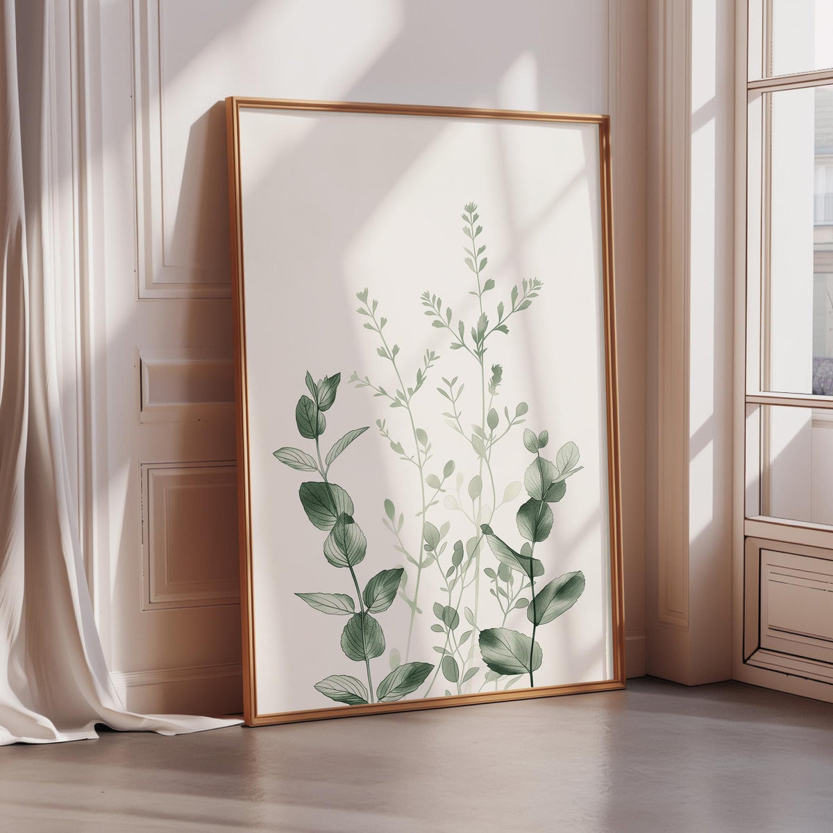 A framed print of a plant with green leaves is displayed on a wall in a room with a window.