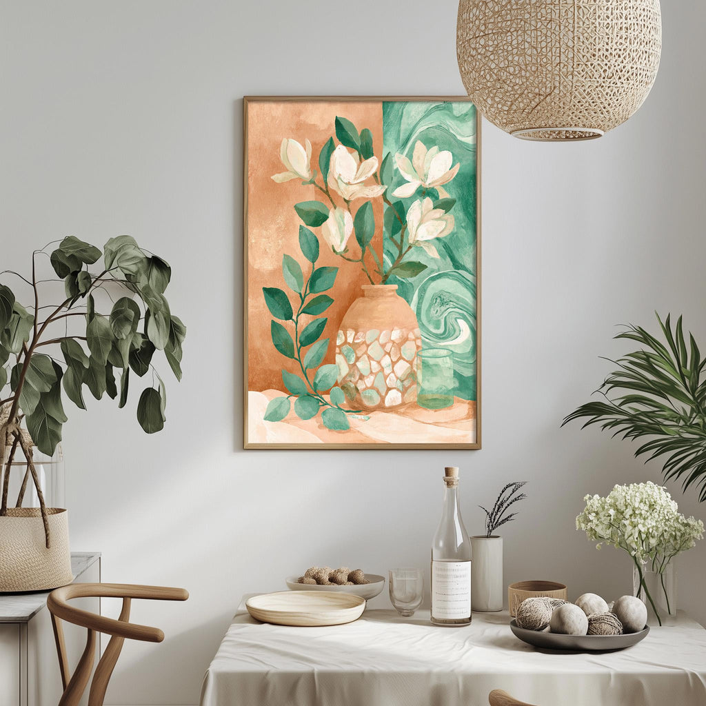 a dining table with a white tablecloth, a vase of flowers, and a bottle of wine. The table is set with plates, bowls, and other tableware. A framed painting of flowers is hanging on the wall above the table.