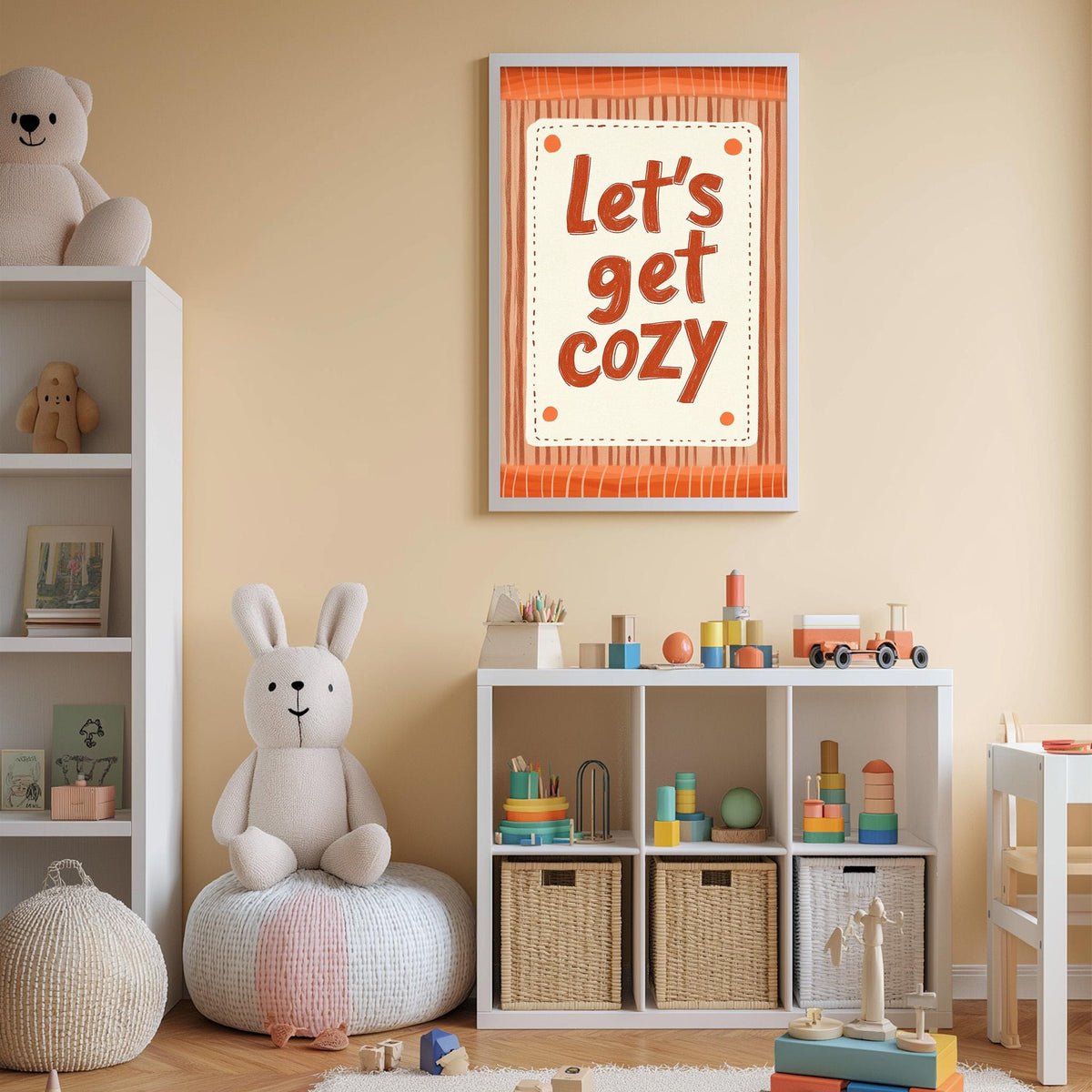 A cozy children's room with a stuffed rabbit, a toy train, and a bookshelf filled with toys and books. A framed wall sign with the text "Let's get cozy" is displayed above the bookshelf.