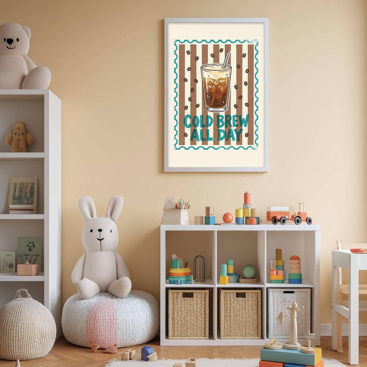 A child's bedroom with a white bookshelf, a stuffed rabbit, and a toy train. Above the bookshelf is a framed poster with the text "COLD BREW ALL DAY".