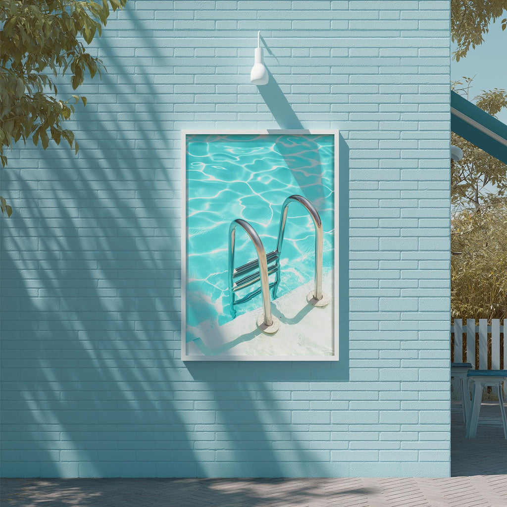 a blue brick wall with a framed picture of a swimming pool and a metal ladder hanging on it.