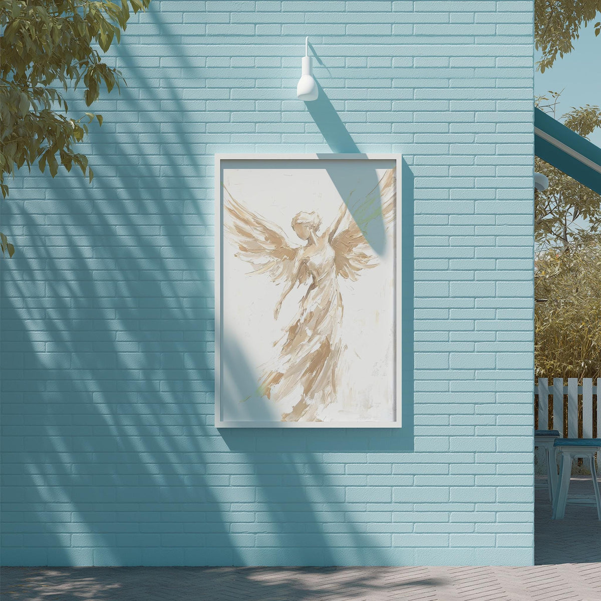 a blue brick wall with a framed painting of an angel with outstretched wings hanging on it.