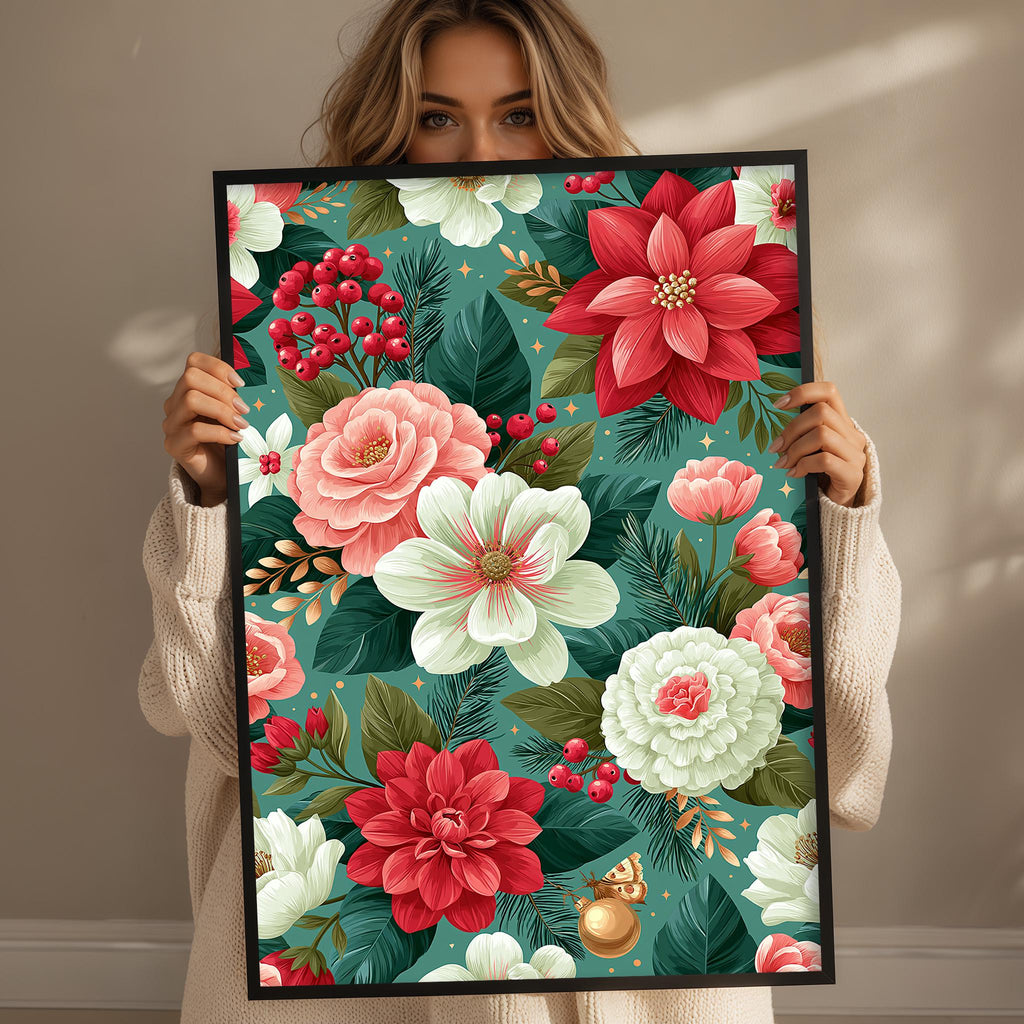 A woman is holding up a framed print with a vibrant floral design featuring red, pink, white, and green flowers, leaves, and berries.