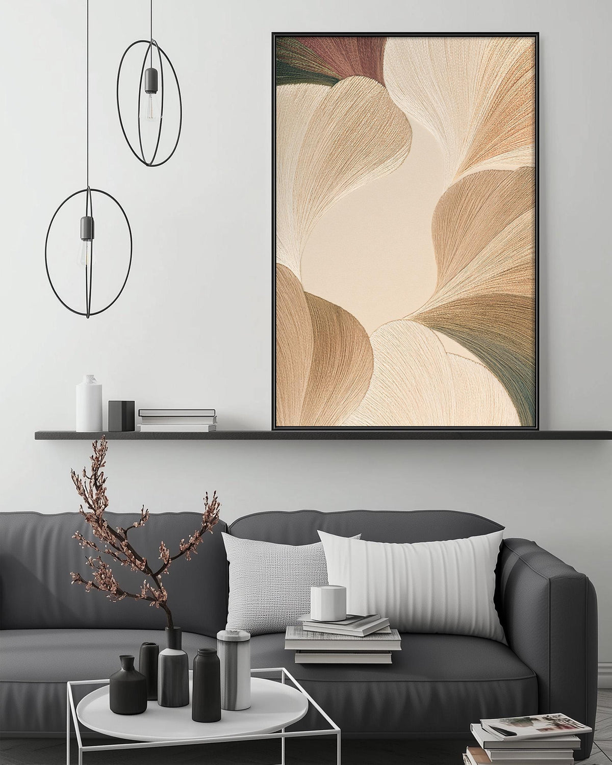 a modern living room with a gray sofa, a coffee table, and a large abstract painting hanging on the wall above the sofa.