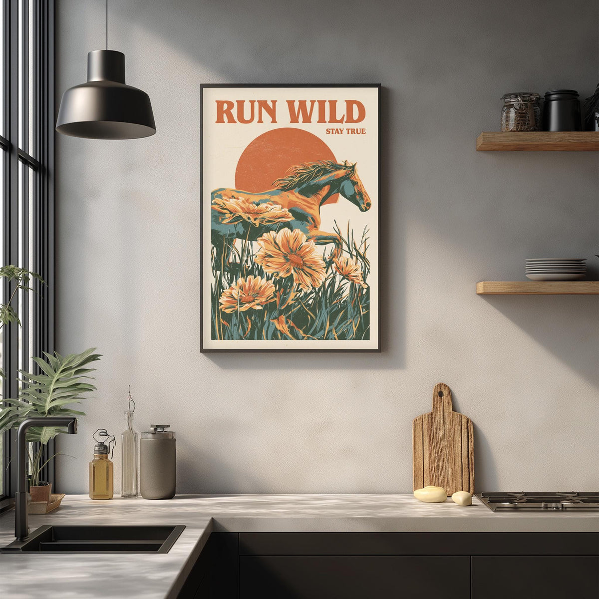a kitchen counter with various items on it, such as a cutting board, a bottle, and a vase. Above the counter, there is a framed poster of a horse surrounded by flowers, and the poster has the text "RUN WILD STAY TRUE" written on it.