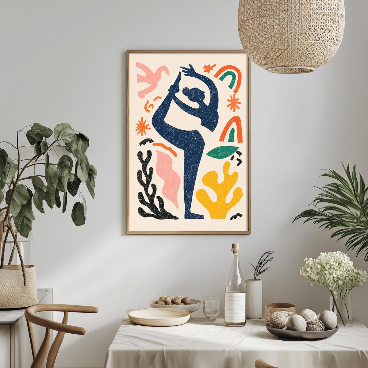 a vibrant and colorful abstract art piece hanging on a wall above a dining table. The art piece is a framed painting with a stylized figure in a dynamic pose, surrounded by various geometric shapes and patterns in a variety of colors. The dining table is set with plates, bowls, and other tableware, creating a cozy and inviting atmosphere. The room is decorated with potted plants and other decorative elements, adding a touch of nature and warmth to the space.