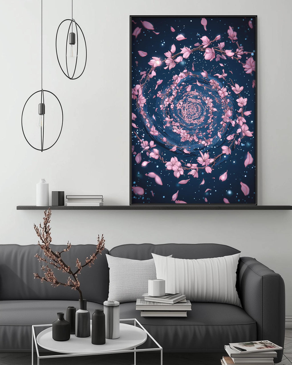 a modern living room with a gray sofa, a coffee table, and a large framed artwork depicting a spiral pattern of pink flowers against a dark blue background.