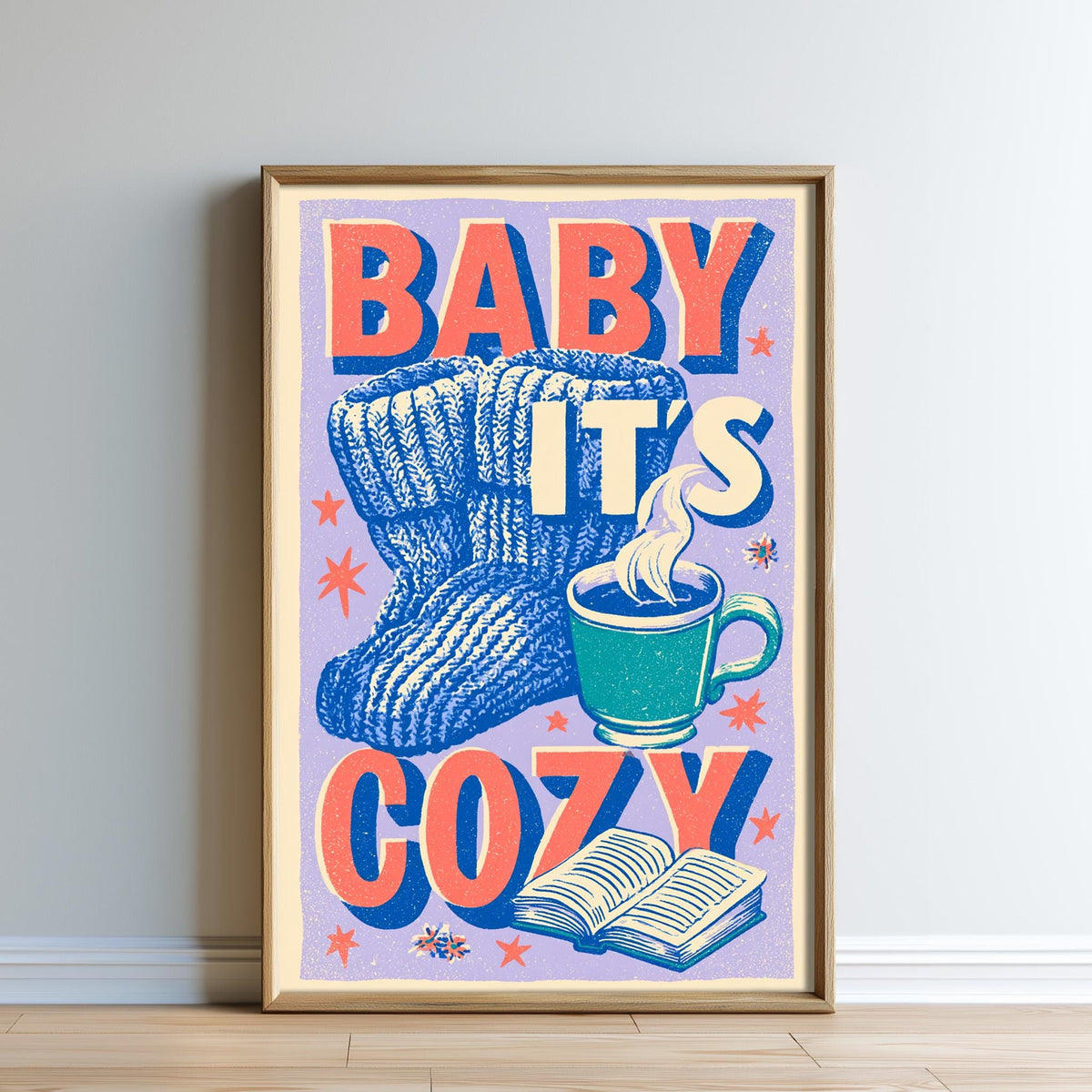 The image is a framed poster with a colorful design featuring a pair of blue and white striped socks, a cup of hot beverage, and an open book, all set against a purple background with orange and white accents.