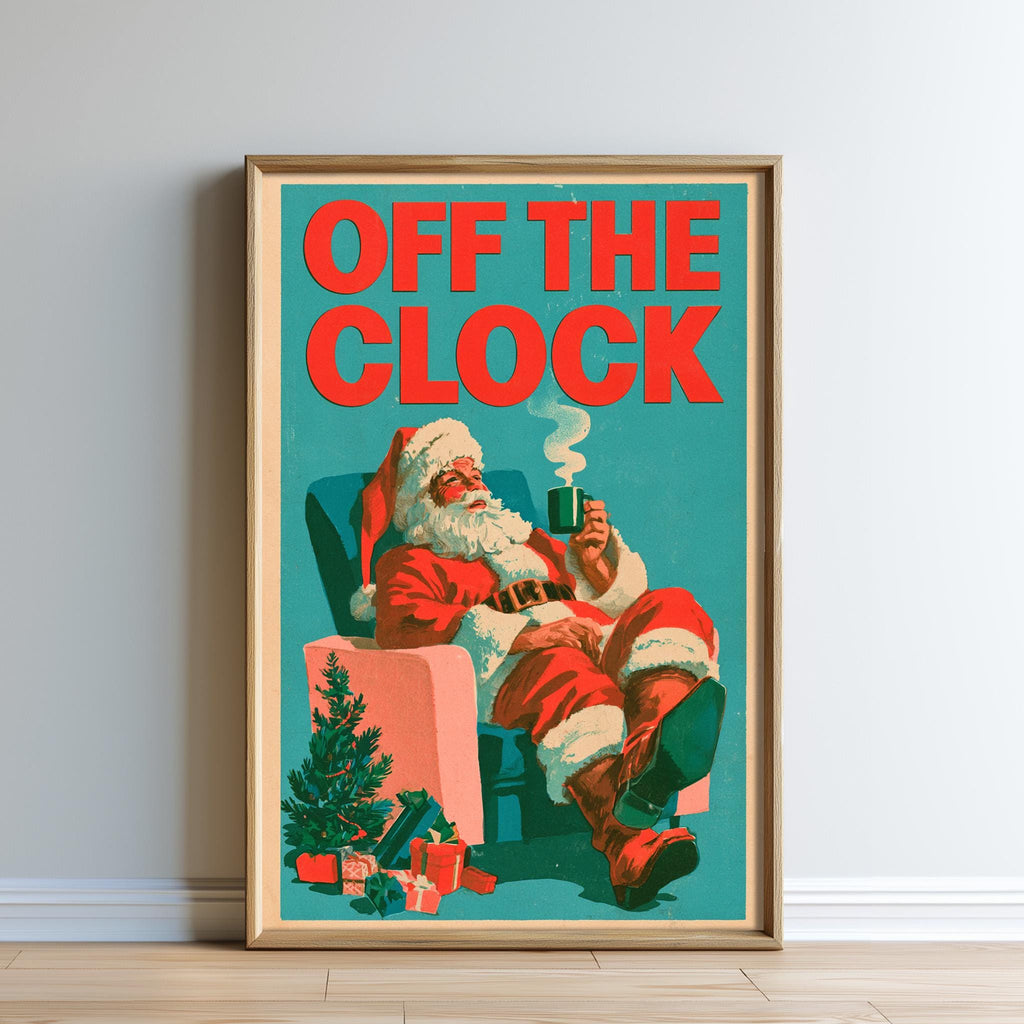 A framed vintage poster depicting Santa Claus sitting in a chair, holding a cup of coffee, with a Christmas tree and presents in the background.