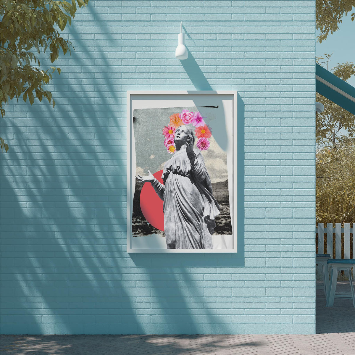 a framed artwork of a woman with a floral headpiece, displayed on a blue brick wall.