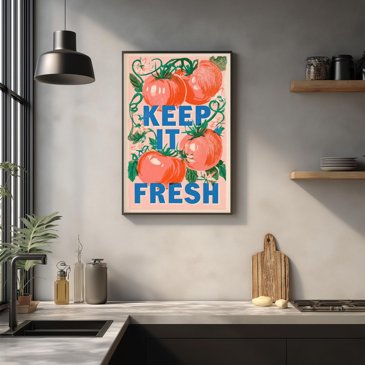 a kitchen counter with a framed poster that reads "KEEP IT FRESH" above it. The poster has illustrations of tomatoes and other kitchen items.