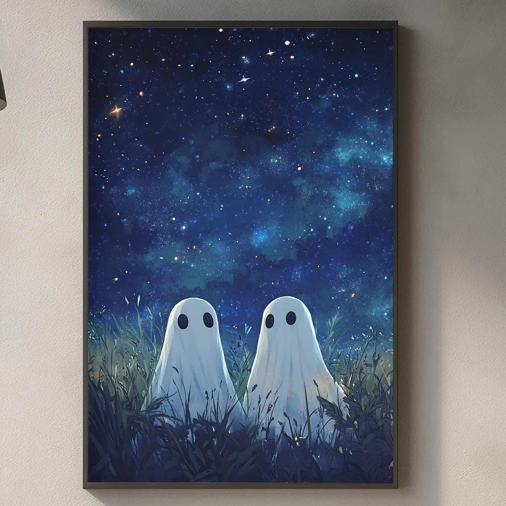 a kitchen counter with a framed artwork of two ghostly figures gazing at each other against a starry night sky backdrop. The kitchen counter also has various kitchen items such as a cutting board, a bottle, and a vase.