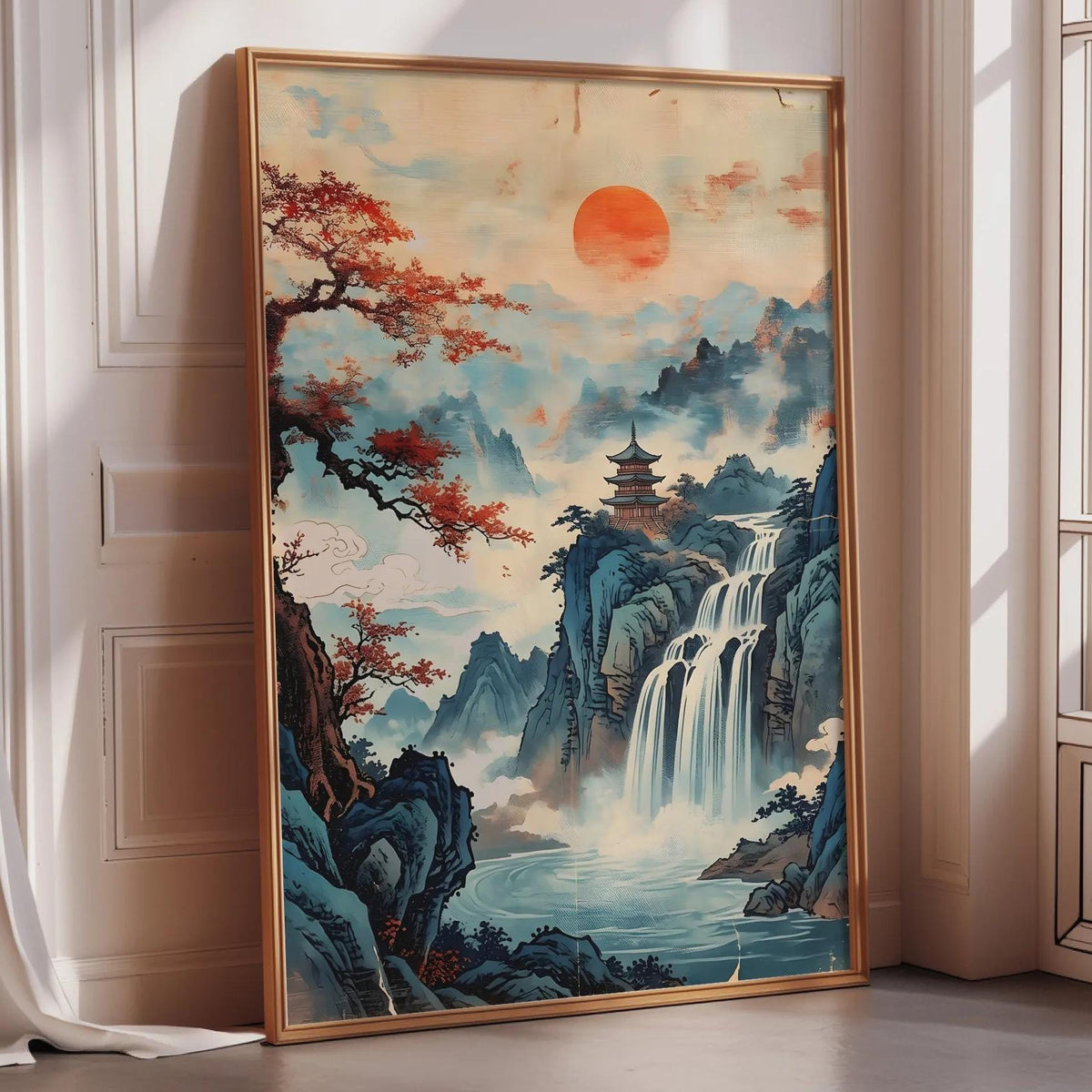 A large framed painting depicting a serene landscape with a waterfall, mountains, and a pagoda in the background, set against a vibrant sky with a large orange sun.