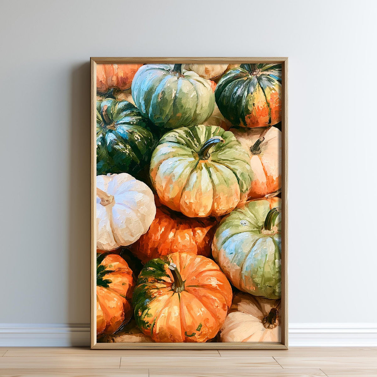 A framed collage of various pumpkins in different colors, including white, orange, green, and red, arranged on a wall.